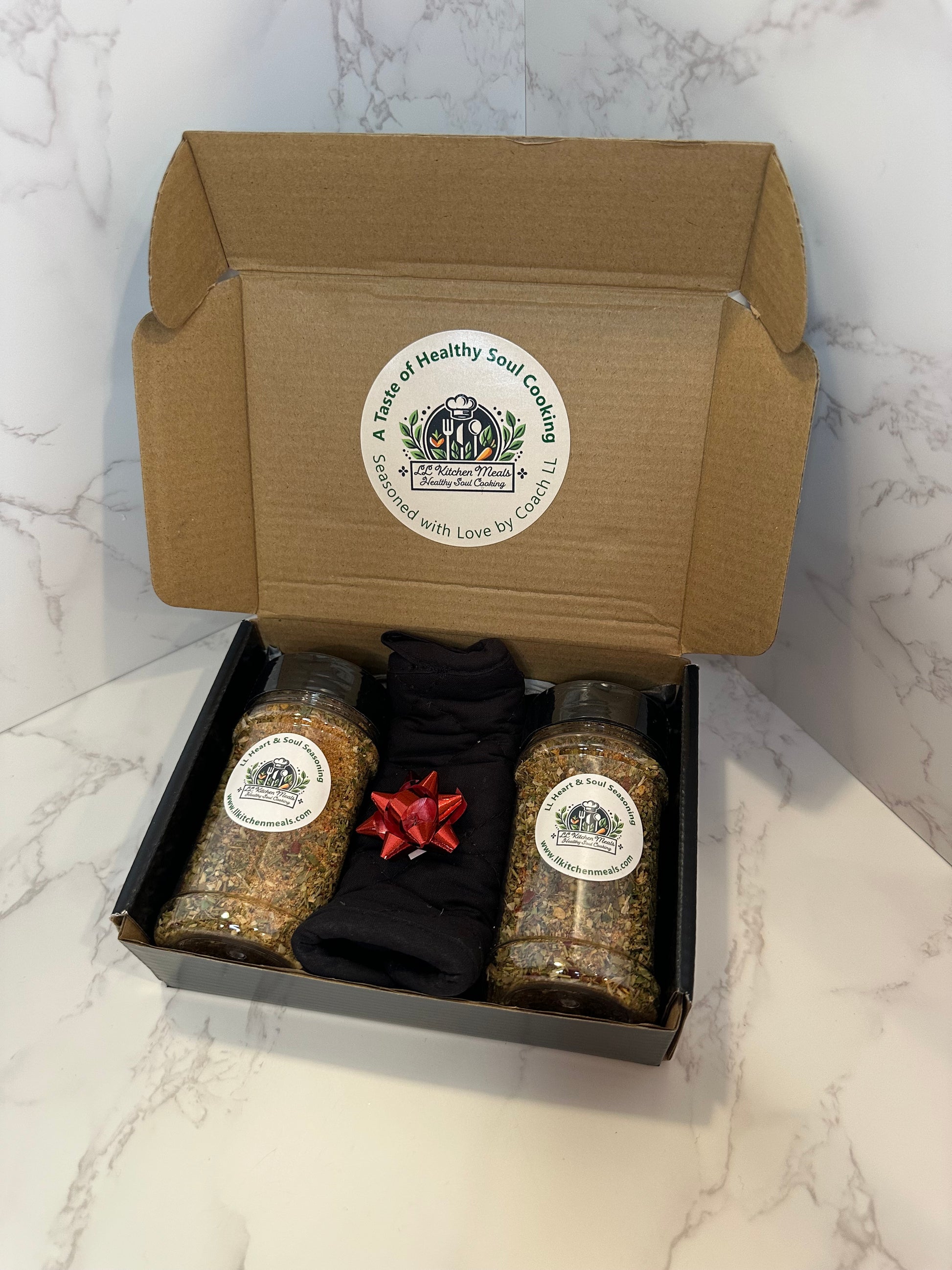 Soulful Duo Gift Box featuring jumbo jars of LL Kitchen Meals Heart & Soul Seasoning with oven mitt and mini spice keychain